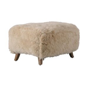 Cabana Footstool in long-haired New Zealand sheepskin with wooden legs