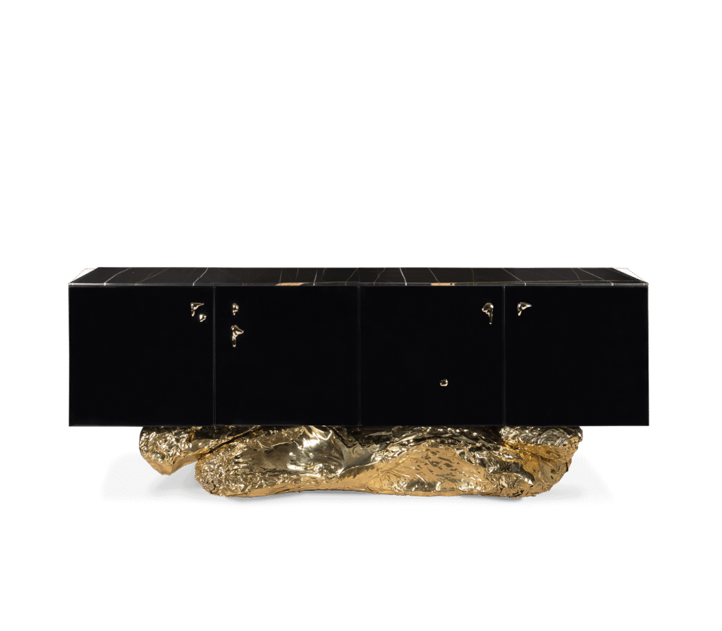 Bold black sculptural sideboard with asymmetrical silhouette and molten gold base – Angra by Boca do Lobo