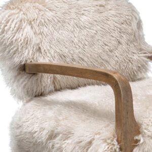 Close-up of Cabana Armchair – hand-carved wood meets thick New Zealand sheepskin