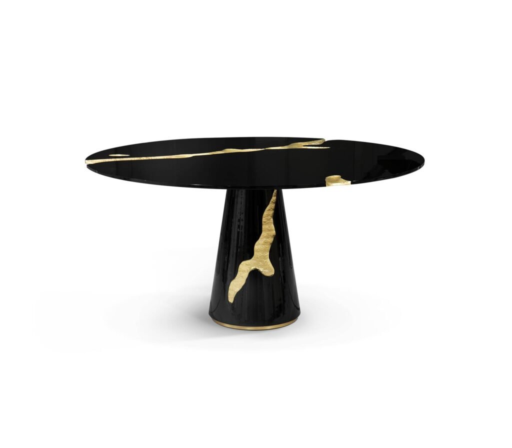 Lapiaz Dining Table by Boca do Lobo in high-gloss black lacquer, featuring a sculptural round tabletop and base with polished brass inlays tracing natural fissures.